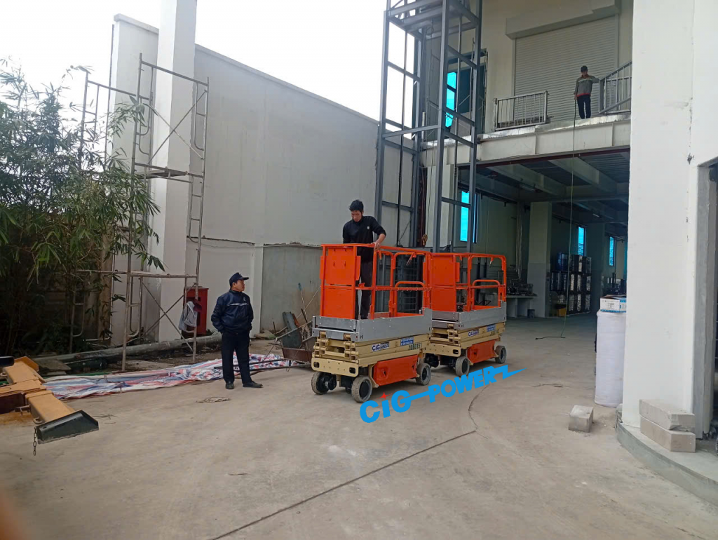 Cho thuê xe nâng người cắt kéo tại Hòa lạc, Hà nội